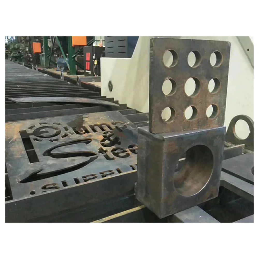 Dual-head plasma cutting machine profiling plate parts in a fabrication shop