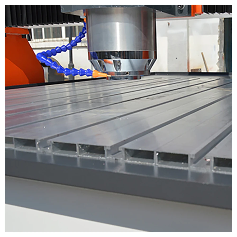 CNC router table with clamping for heavy slabs